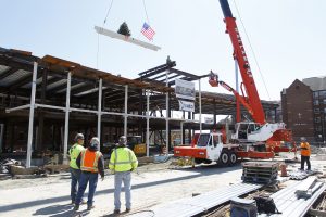 A beam is placed in the Ryan Center during the Topping Off Ceremony.