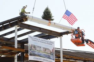 A beam is placed in the Ryan Center during the Topping Off Ceremony.