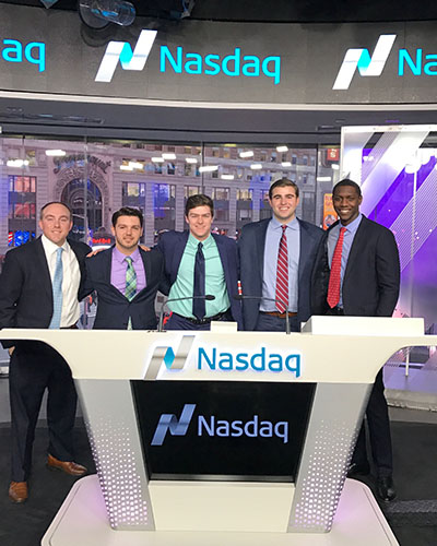 Providence College School of Business students and alumni at the Nasdaq Closing Bell