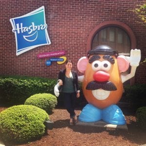 woman standing outside with an oversized Mr. Potato Head
