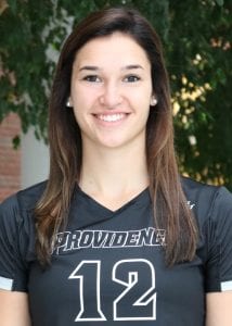 female with brown hair in a providence t-shirt with the number twelve on it - a headshot