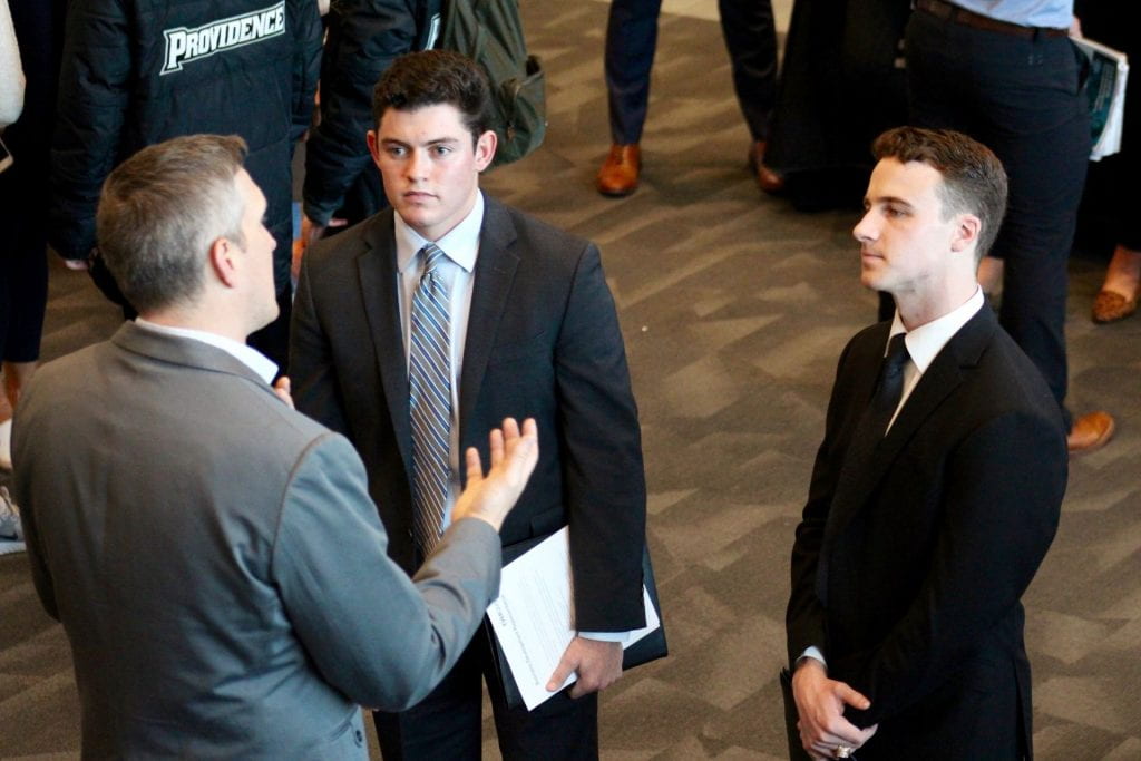 three men talking