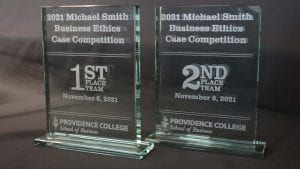 Photos of glass plaques for the 2021 Michael Smith Business Ethics Case Competition