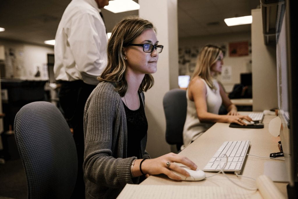 Two female students at Mac computers