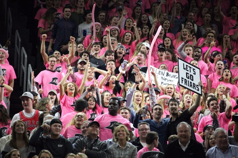 The student section dressed all in pink at the Providence basketball game vs. Villanova cheering on the friars.