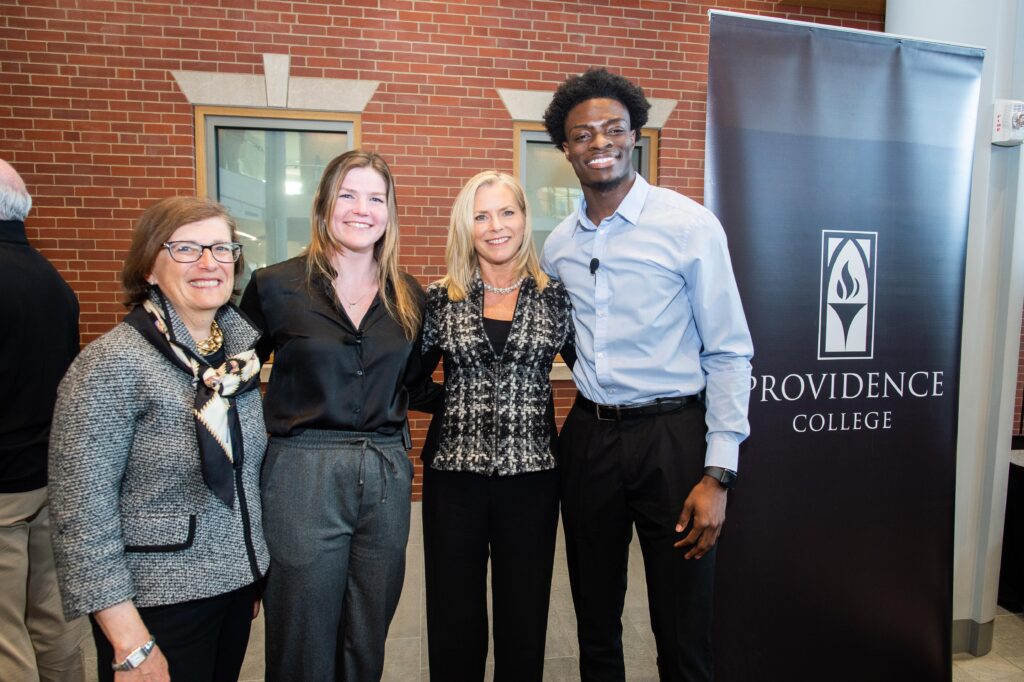 PCSB Dean Sylvia Maxfield and student moderators Anna LaFortune ’22 and Joseph Adegboyega ’22 pose for a photo with Kelly Grier of EY, who spoke at the 2022 PCSB Dean's Symposium.