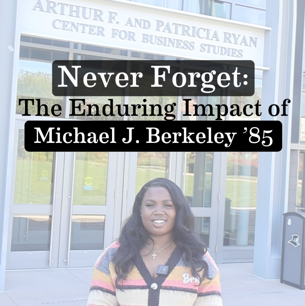 Jelissa Jonas '27 in from of the Ryan Center for business studies "The Enduring Impact of Micheal J. Berkeley '85"