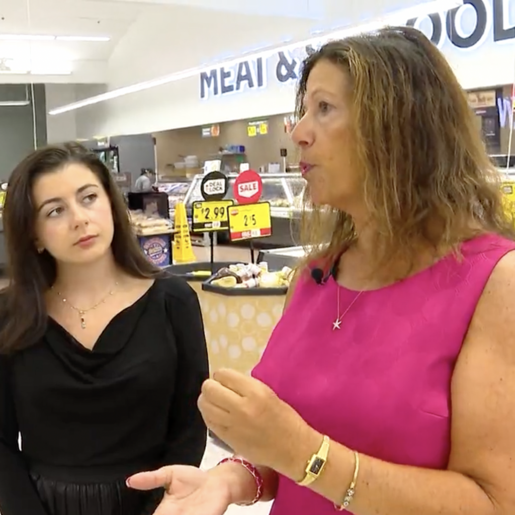 Rae Caloura, MBA '94G, talking with an interviewer for a WPRI news segment.
