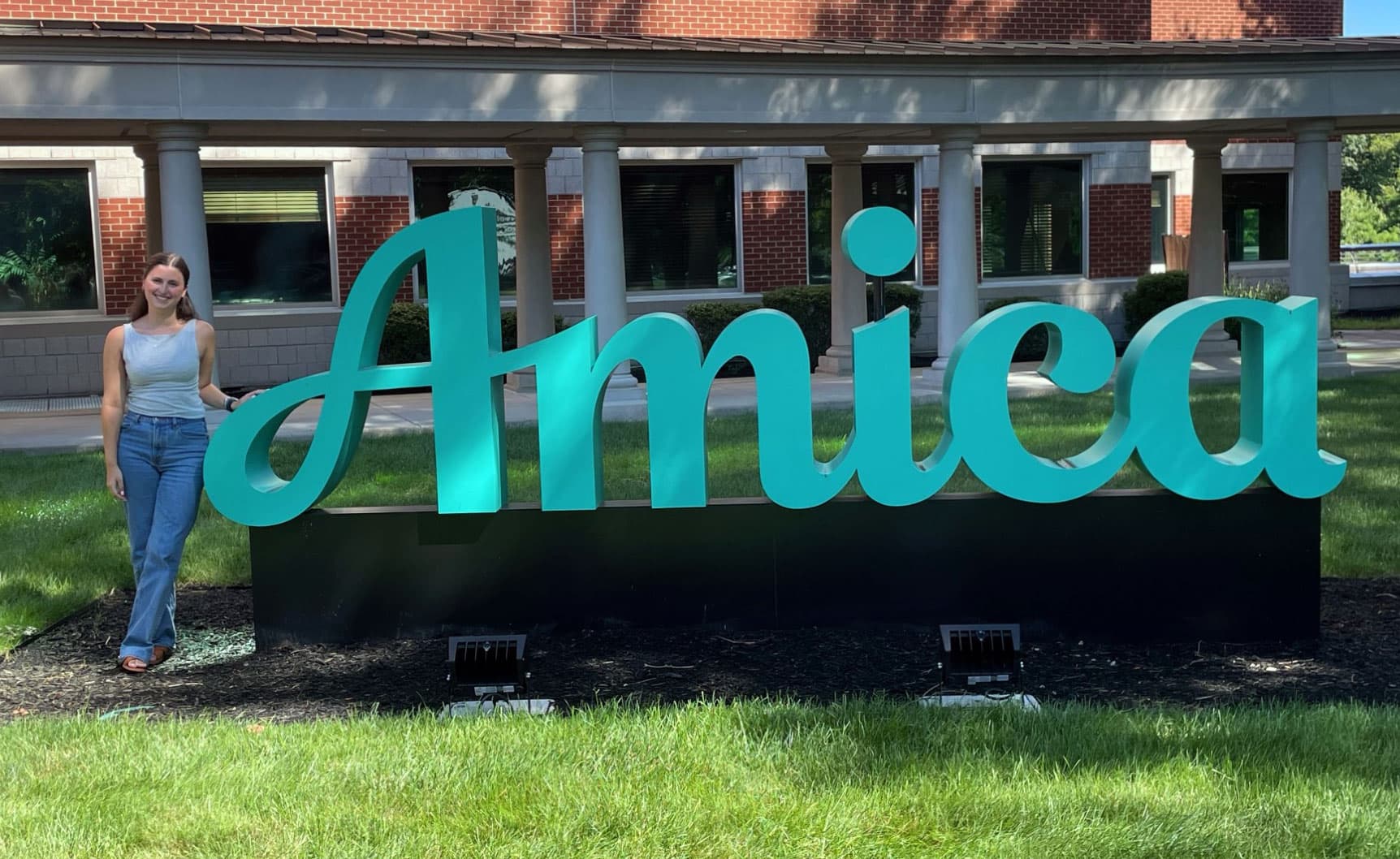 Kayla Ferullo standing outside Amica office