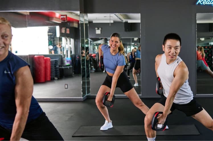 Maddie Frick lunging during a Bodypump class.