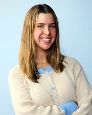 Headshot of Maddie Frick against a light blue background.